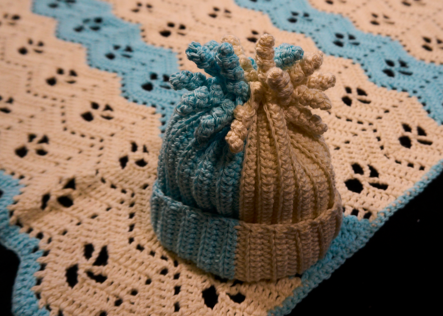 Peach and blue baby blanket with matching hat