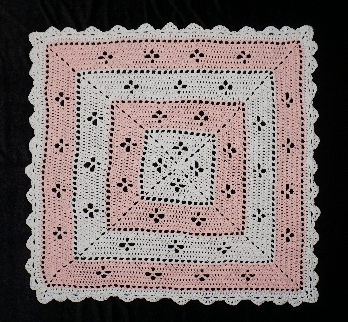 Soft, cuddly hand-crocheted cotton blanket with pink and white squares