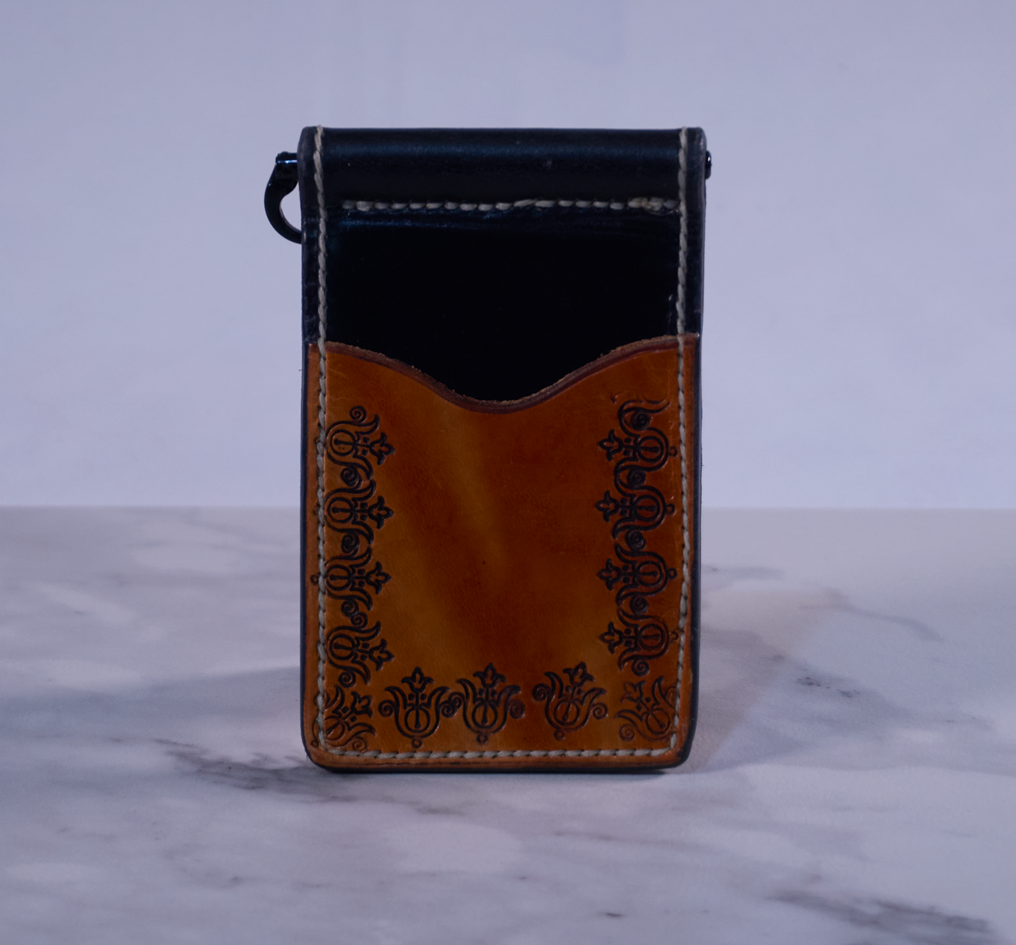 Monel clip with black exterior and hand-tooled tan exterior pockets