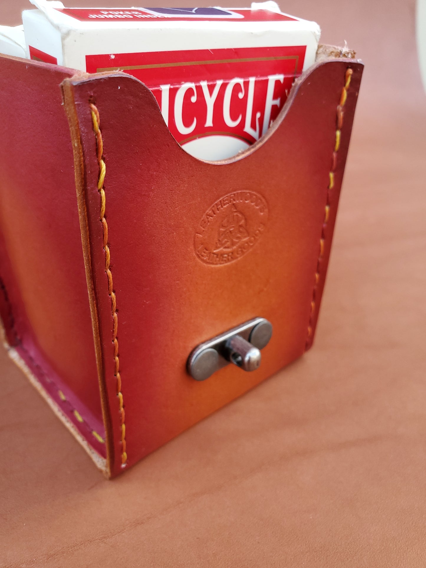 Hand-stitched card box with swing latch