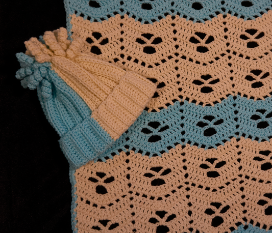 Peach and blue baby blanket with matching hat