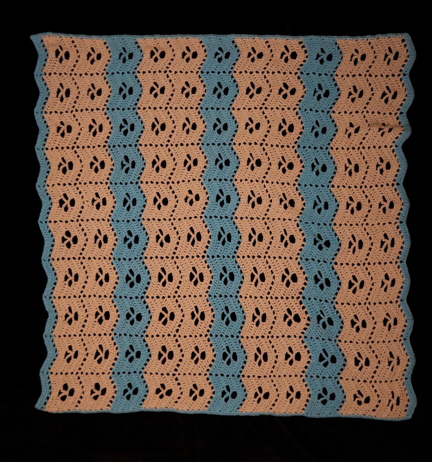Peach and blue baby blanket with matching hat
