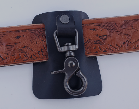 Heavy-duty trigger swivel snap to hold keyrings, mounted on thick black leather with belt slots.