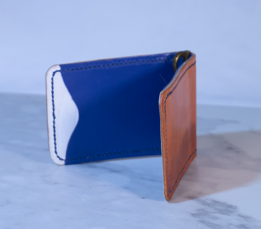Money clip with orange exterior, white lining and blue pockets