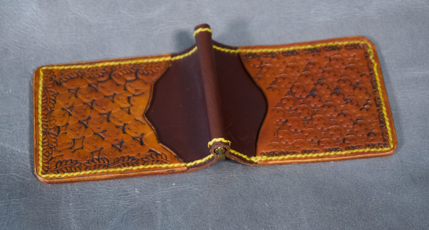 Exterior view of money clip with premium brown leather and two hand-tooled exterior card pockets showing brass money clip